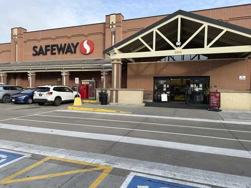 A shopper heads into a Safeway store, which is part of the Albertson's grocery chain, Tuesday, Dece…