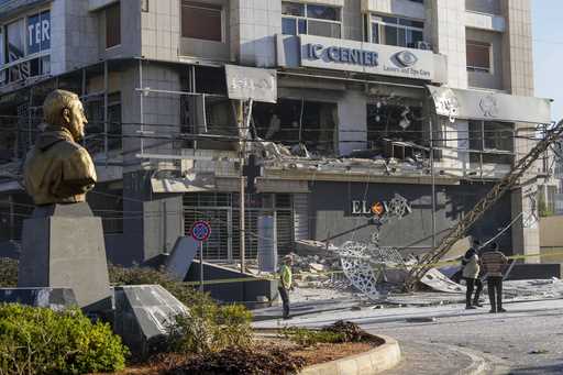 A bust of late Iranian General Qassem Soleimani, stands in front of a destroyed branch of the Hezbo…