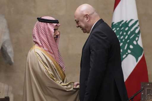 Lebanese President Joseph Aoun, right, shakes hands with Saudi Arabia's Foreign Minister Prince Fai…