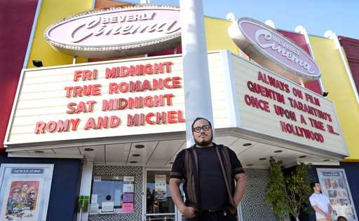 Cinephile Miles Villalon poses near the marquee of the New Beverly Cinema revival theater, Friday, …