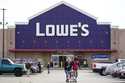 Shoppers walk in the lot of a Lowe's home improvement store in Philadelphia, Wednesday, November 17…