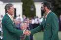 Fred Ridley, chairman of Augusta National Golf Club, shakes hands with Winner Scottie Scheffler at …