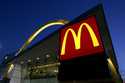 The McDonald's restaurant logo and golden arch is lit up, April 20, 2006, in Chicago