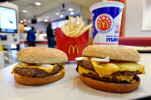 FILE- In this March 6, 2018, file photo, a McDonald's Quarter Pounder, left, and Double Quarter Pou…