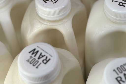 Bottles of raw milk are displayed for sale at a store in Temecula, Calif