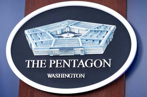 The Department of Defense logo is seen on the wall in the Press Briefing room at the Pentagon, Octo…