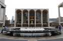 People appear in Josie Robertson Plaza in front of The Metropolitan Opera house at Lincoln Center i…