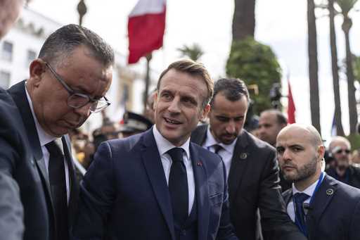 French president Emmanuel Macron meets with Moroccans after delivering a speech in the Parliament, …