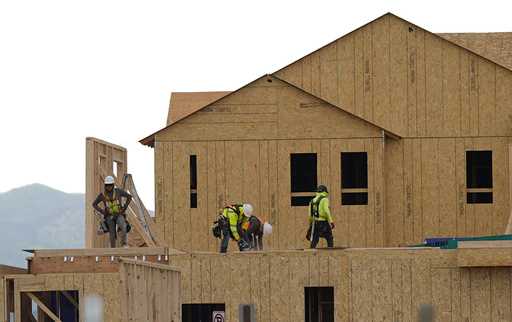 Workers construct new homes in a development on Tuesday, June 25, 2024, in Loveland, Colo