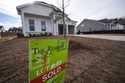 A sign announces the sale of a new home, January 16, 2024, in Kennesaw, Ga