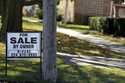 A "For Sale by Owner" sign is displayed in front of a home in Niles, Ill