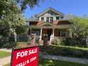 FILE- A for sale sign stands outside a home on the market in the Alamo Placita neighborhood Tuesday…