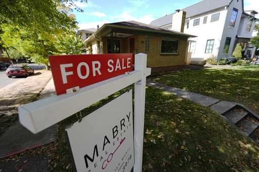 A sale sign stands outside a home on the market Thursday, October 17, 2024, in the east Washington …