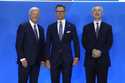 President Joe Biden, left, and NATO Secretary General Jens Stoltenberg, right, greet Alexander Stub…