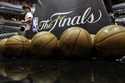 NBA basketballs and the NBA Finals logo are seen on the court prior to Game 1 of the NBA Finals bas…