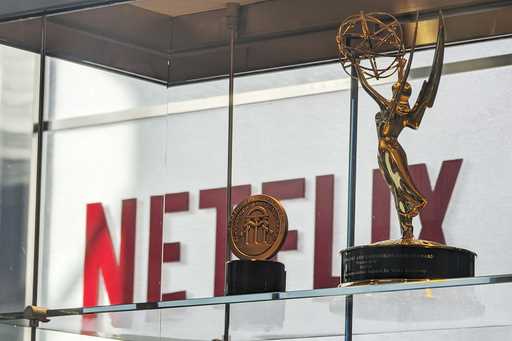 Awards, including an Emmy, are displayed at Netflix headquarters Los Gatos, Calif