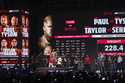 Mike Tyson steps on the scale during a weigh-in ahead of his heavyweight bout against Jake Paul, in…