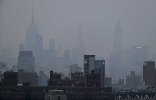 A thick haze hangs over Manhattan in New York on July 20, 2021. (AP Photo/Julie Jacobson, File)