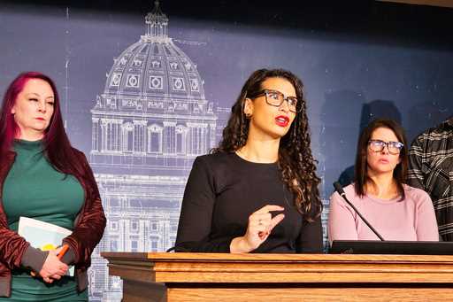 Minnesota Democratic State Senator Erin Maye Quade, center, discusses her bill to crack down on "nu…