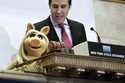 Miss Piggy, with New York Stock Exchange Chief of Staff John Tuttle, rings the NYSE opening bell to…