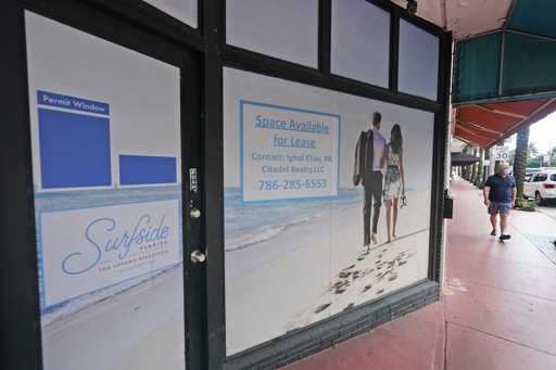 A pedestrian walks past an empty business available for lease, October 12, 2020, in downtown Surfsi…
