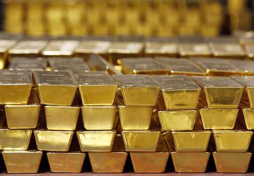 Gold bars are shown stacked in a vault at the United States Mint on July 22, 2014 in West Point, N