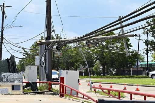 Utility polls wait for repair after being damaged by Hurricane Beryl in Houston, July 10, 2024