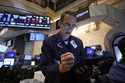 Trader Gregory Rowe works on the floor of the New York Stock Exchange, Monday, July 22, 2024