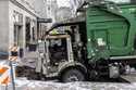 A garbage truck is stuck in a sinkhole in downtown Omaha, Neb