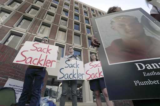 Protesters gather outside a courthouse on Friday, August 2, 2019, in Boston, where a judge was to h…