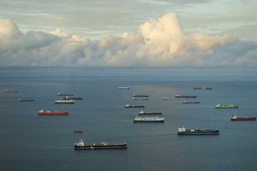 Cargo ships wait to transit the Panama Canal in Panama City, Friday, June 28, 2024