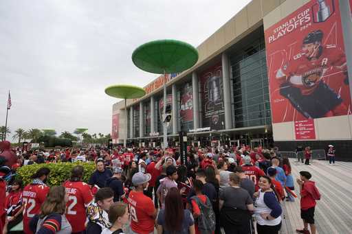 FILE -Fans wait in line to watch Game 4 of the Stanley Cup Final between the Florida Panthers and t…