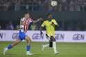 Brazil's Vinicius Junior, right, and Paraguay's Hugo Cuenca eye the ball during a qualifying soccer…