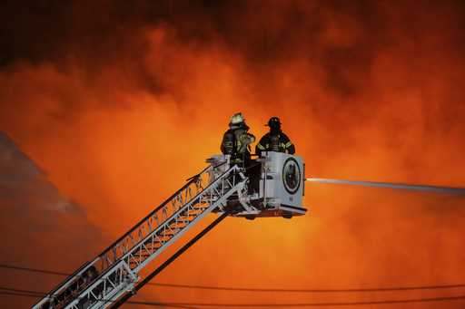 Firefighters battle a blaze at SPS Technologies in Jenkintown, Pa