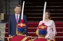 Chinese President Xi Jinping, left, and Peru's Prime Minister Gustavo Adrianzen, wave on the airpor…