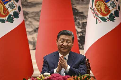 China's President Xi Jinping applauds during a signing ceremony with Peru's President Dina Boluarte…