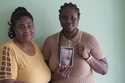 Rita Breus, left, and her daughter Rivly, holds a photo of her grandmother Erzule Paul, who the fou…