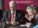 Warren Buffett, Chairman and CEO of Berkshire Hathaway, left, plays bridge with Bill Gates, followi…