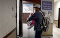 Alex Berrios walks into his dialysis session in Louisville, Ky