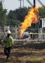 An above-ground valve continues to burn three days after after a vehicle drove through a fence alon…