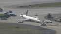 A plane sits damaged at Hartsfield-Jackson Atlanta International Airport after colliding with anoth…