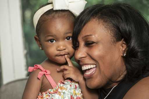 Raquel Robinson poses with her one-year-old daughter Londyn Crenshaw at their home in Cleveland Hei…