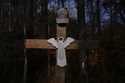 Willie Crayton's hat hangs on a cross bearing the Lord's Prayer and marking the location along Elde…