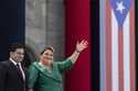 Jenniffer Gonzalez Colon waves alongside her husband Jose Yovin Vargas during her swearing-in cerem…