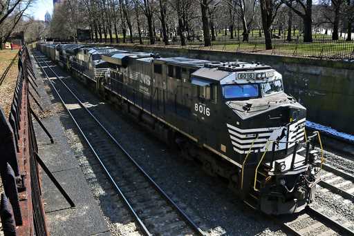 A Norfolk Southern freight train rolls through downtown Pittsburgh, on March 26, 2018