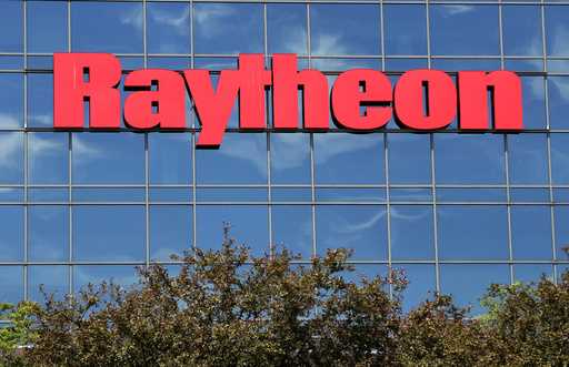 The sky is reflected on the facade of Raytheon's Integrated Defense Systems facility, Monday, June …