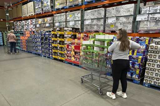 Shoppers consider purchases in a Costco warehouse Thursday, Sept