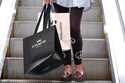 A shopper carries bags in Pittsburgh on June 3, 2024. (AP Photo/Gene J. Puskar, File)