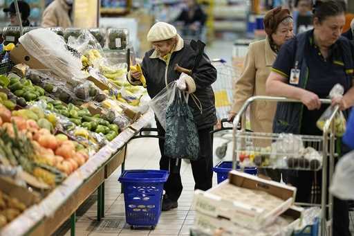 People buy fruits at a hypermarket in Moscow, Russia, on November 3, 2023. (AP Photo, File)