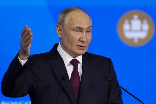Russian President Vladimir Putin addresses a plenary session of the St